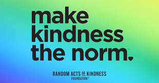 Rainbow colored background with the words Make kindness the Norm.